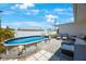 A charming above-ground pool with a lounge area creates a perfect backyard retreat at 11619 80Th Ave, Seminole, FL 33772
