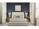 Stylish bedroom featuring a neutral-colored headboard, bedside lamps, and an area rug at 11744 E 71St Ter, Palmetto, FL 34221