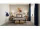 Cozy bedroom with a metal-framed bed, two side tables with lamps, and a dinosaur print at 11744 E 71St Ter, Palmetto, FL 34221