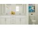 Elegant bathroom with double vanity, modern fixtures, ample storage space, and neutral decor at 11848 Blue Diamond Trl, Parrish, FL 34219