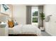Light and airy bedroom with large window, gray curtains and an accent painting at 11848 Blue Diamond Trl, Parrish, FL 34219