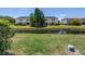 Scenic backyard with lush green grass and water view at 12323 Country White Cir, Tampa, FL 33635