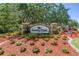 Beautifully landscaped entrance sign for Country Chase, showcasing curb appeal at 12323 Country White Cir, Tampa, FL 33635