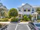 Charming townhome featuring shutters, a front porch, and manicured landscaping at 12323 Country White Cir, Tampa, FL 33635