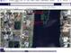 Aerial view of property and neighborhood with beautiful lakeside location at 128 Torrington St, Port Charlotte, FL 33954