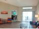 Inviting living area offers access to the pool through sliding glass doors with a view of the pool at 128 Torrington St, Port Charlotte, FL 33954