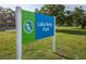 Lake Betty Park sign with the Charlotte County logo in a grassy area with trees at 128 Torrington St, Port Charlotte, FL 33954