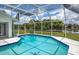 Refreshing pool features screened enclosure with beautiful scenery at 128 Torrington St, Port Charlotte, FL 33954