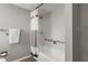 Clean bathroom with white tiled shower and functional grab bars at 14542 Anchorage Cir, Seminole, FL 33776