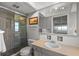 Well-maintained bathroom with glass enclosed shower, neutral colors, and functional design at 14542 Anchorage Cir, Seminole, FL 33776