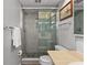 Bathroom featuring a glass shower enclosure, tiled walls, and a modern vanity at 14542 Anchorage Cir, Seminole, FL 33776