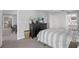 View of a comfortable bedroom leading to a dining area and bathroom, showcasing the home's layout at 14542 Anchorage Cir, Seminole, FL 33776