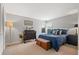 Comfortable bedroom with neutral paint, carpet and stylish furniture at 14542 Anchorage Cir, Seminole, FL 33776