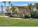 Clubhouse exterior with lush landscaping and well-maintained grounds at 14542 Anchorage Cir, Seminole, FL 33776