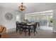 Charming dining area with stylish seating adjacent to a bright patio space at 14542 Anchorage Cir, Seminole, FL 33776