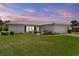 Charming home with well-manicured lawn, pretty landscaping and attached two-car garage at 14542 Anchorage Cir, Seminole, FL 33776