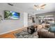 Welcoming living room with hardwood floors and an entertainment area at 14542 Anchorage Cir, Seminole, FL 33776
