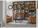 Comfortable living room featuring a custom bookcase, stylish decor, and neutral colors at 14542 Anchorage Cir, Seminole, FL 33776
