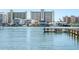 Beautiful waterfront view of buildings along the water with several docks and boats at 14542 Anchorage Cir, Seminole, FL 33776