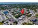 Aerial view of the residential community with lush landscaping and a red marker indicating location at 149 Sky Loch Dr E, Dunedin, FL 34698