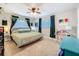Relaxing bedroom with carpet floors, two windows, and a desk at 149 Sky Loch Dr E, Dunedin, FL 34698