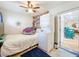 Bedroom features a ceiling fan, a laundry, and outdoor entrance at 149 Sky Loch Dr E, Dunedin, FL 34698