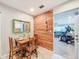 Bright dining area next to the kitchen leads into the living room at 149 Sky Loch Dr E, Dunedin, FL 34698