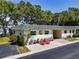 Charming single-story home with well-maintained landscaping and cozy curb appeal at 149 Sky Loch Dr E, Dunedin, FL 34698
