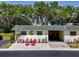 Charming single-story home features a well-kept lawn, carport, and inviting curb appeal at 149 Sky Loch Dr E, Dunedin, FL 34698