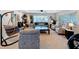 Spacious living room with neutral colors, cozy seating, and plenty of natural light at 149 Sky Loch Dr E, Dunedin, FL 34698