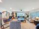 Relaxing living room showcasing a hanging chair, comfortable seating, and ample space at 149 Sky Loch Dr E, Dunedin, FL 34698