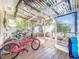 Enclosed sun room provides a tranquil space to relax and enjoy the outdoors at 149 Sky Loch Dr E, Dunedin, FL 34698