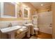 Bright bathroom featuring double sinks and bathtub-shower combination at 1910 E Palm Ave # 10209, Tampa, FL 33605
