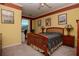 Comfortable bedroom with a ceiling fan, desk, and natural light at 1910 E Palm Ave # 10209, Tampa, FL 33605