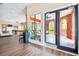 Inviting clubhouse entrance showcasing a glimpse of interior amenities and an outdoor patio at 1910 E Palm Ave # 10209, Tampa, FL 33605