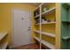 Functional entry area with door and shelving, perfect for storage at 1910 E Palm Ave # 10209, Tampa, FL 33605