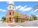 Charming multi-story red brick building featuring unique architectural details and lush landscaping at 1910 E Palm Ave # 10209, Tampa, FL 33605