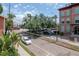 Charming building featuring brick exterior and lush landscaping at 1910 E Palm Ave # 10209, Tampa, FL 33605