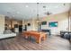 Spacious game room with a pool table, foosball, lounge area, TV and kitchen, perfect for relaxing at 1910 E Palm Ave # 10209, Tampa, FL 33605