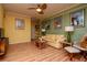 Cozy living room area featuring hardwood floors, sofa and posters at 1910 E Palm Ave # 10209, Tampa, FL 33605