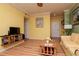 Bright and open living room with hardwood floors, flat screen TV and shelving at 1910 E Palm Ave # 10209, Tampa, FL 33605
