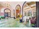 Expansive lobby with high ceilings, striking arches, brick walls, and inviting seating arrangements at 1910 E Palm Ave # 10209, Tampa, FL 33605