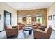 Inviting community lounge with leather armchairs, brick accent wall and natural light, a comfortable meeting space at 1910 E Palm Ave # 10209, Tampa, FL 33605