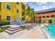Resort-style pool area featuring a fountain, decorative tiling, and comfortable seating for relaxation and enjoyment at 1910 E Palm Ave # 10209, Tampa, FL 33605