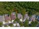 An aerial view of a neighborhood showcasing the property's proximity to green spaces and other houses at 19207 Autumn Woods Ave, Tampa, FL 33647
