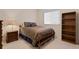 This bedroom has carpet, a ceiling fan, and a wood frame bed at 19207 Autumn Woods Ave, Tampa, FL 33647