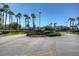Well-maintained community club entrance, showcasing lush landscaping and a welcoming atmosphere at 19207 Autumn Woods Ave, Tampa, FL 33647