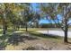 Explore the community park featuring a volleyball court, basketball court, and soccer field nestled among mature trees at 19207 Autumn Woods Ave, Tampa, FL 33647