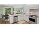 Kitchen features stainless appliances, granite counters and an eat in dining area with views of nature at 19207 Autumn Woods Ave, Tampa, FL 33647