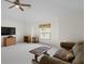 This spacious living room features carpet and a cozy sofa at 19207 Autumn Woods Ave, Tampa, FL 33647